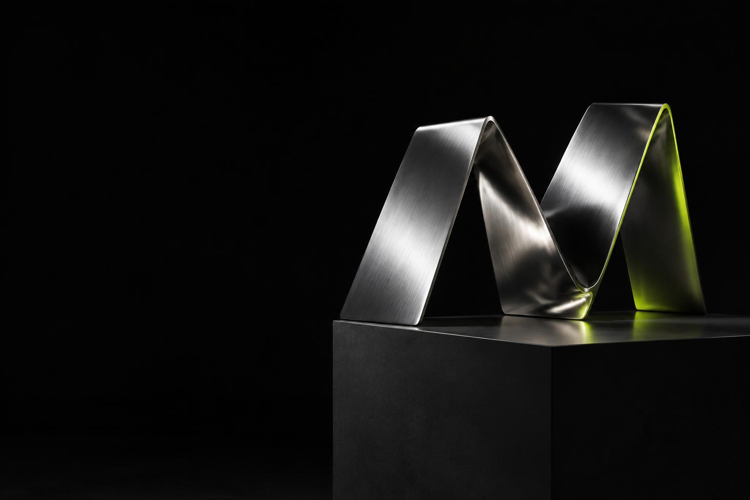 Sculptural chrome M with a lime edge